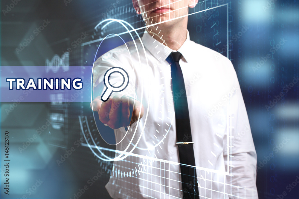 Business, Technology, Internet and network concept. Young businessman working on a virtual screen of the future and sees the inscription: Training Business, Technology, Internet and network concept. Young businessman working on a virtual screen of the future and sees the inscription: Training