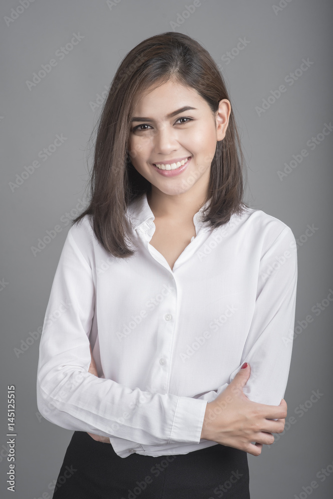 Beautiful Business Woman smiling on grey background Beautiful Business Woman smiling on grey background