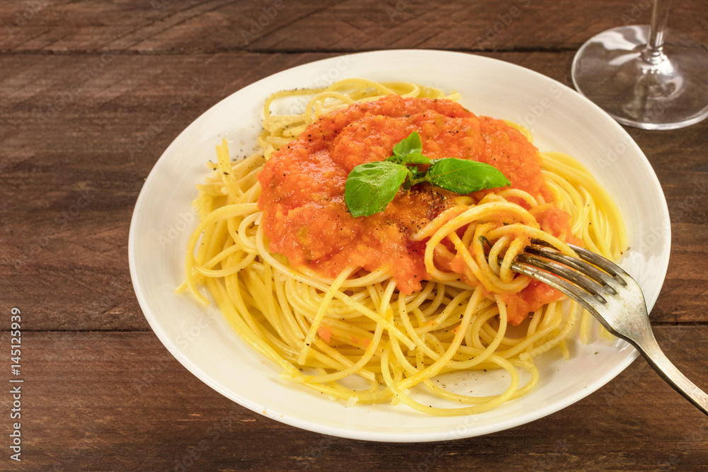 Plate of spaghetti with tomato sauce and copyspace Plate of spaghetti with tomato sauce and copyspace