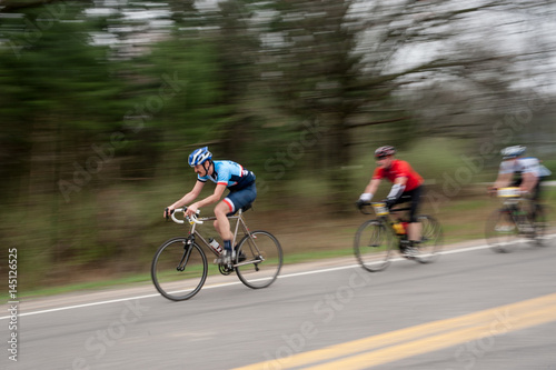 Two bike racers blurred
