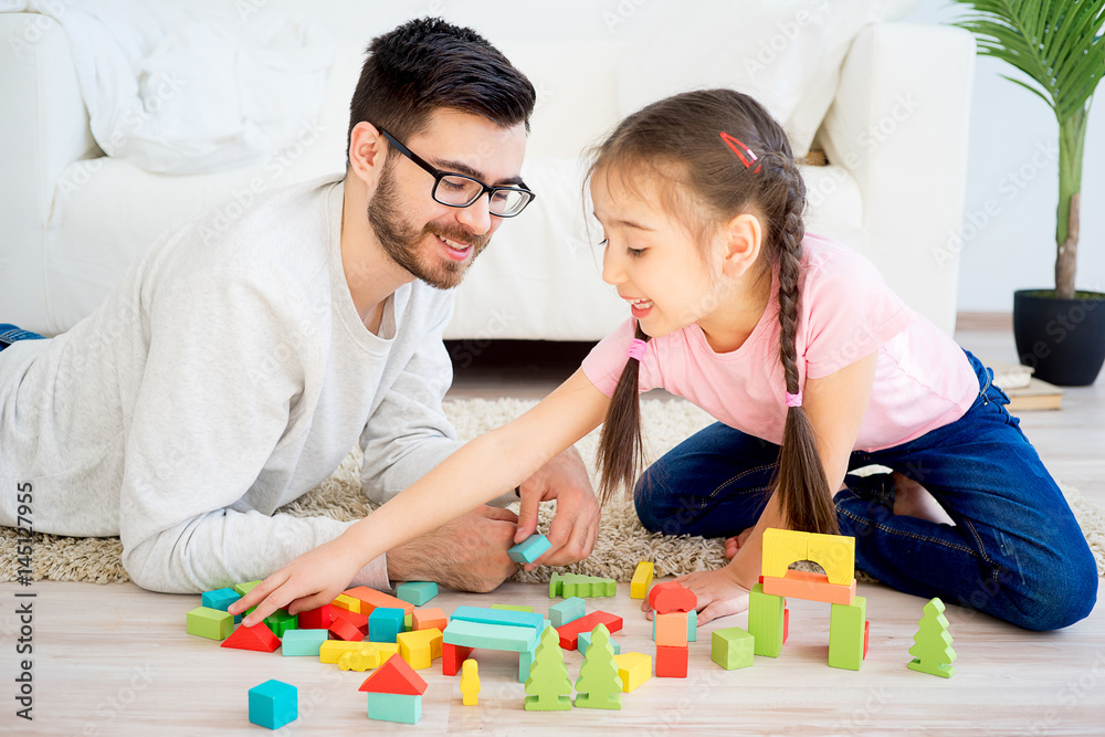 Family playing with toy blocks Family playing with toy blocks