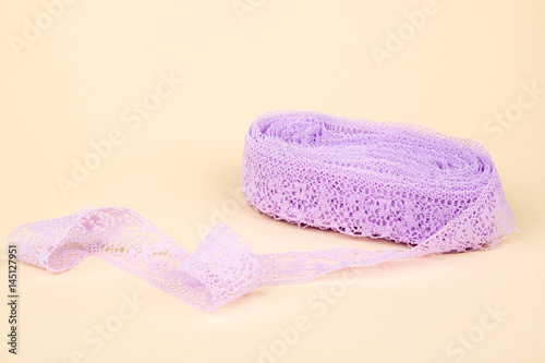 Closeup of ribbon roll over colorful background