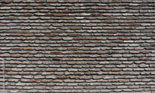 Old stone brick wall in a background image