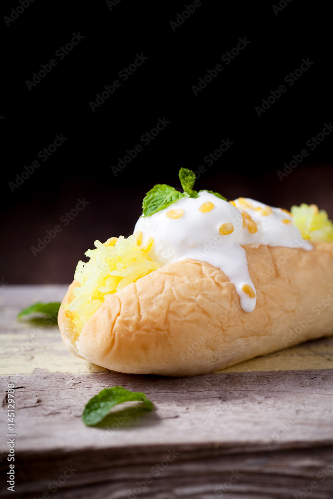 Coconut ice cream with bread on wooden table, Dessert and sweets, selective focus