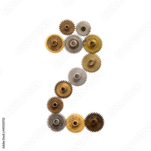 Digit number two steampunk cogwheel gears mechanism. Textured iron bronze metallic surface numeral 2. Aged mechanism wheels connection concept. White background, macro view.