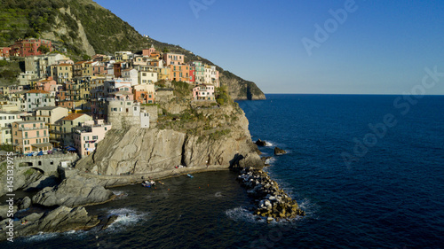Fototapeta Naklejka Na Ścianę i Meble -  Aerial video footage with drone on Manarola , one of the famous Cinqueterre country, small village with colored houses on the cliff over the sea
