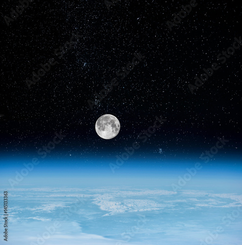 View of Moonset. Moon and the earth's atmosphere view from space (Elements of this image furnished by NASA) © Baranov