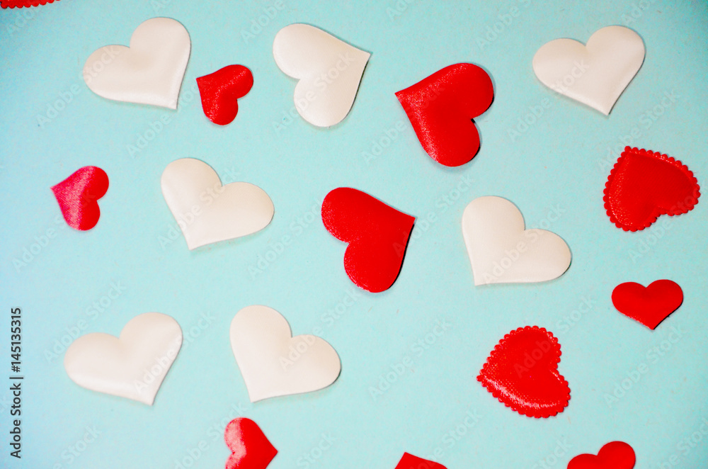 Red and white hearts on a blue background