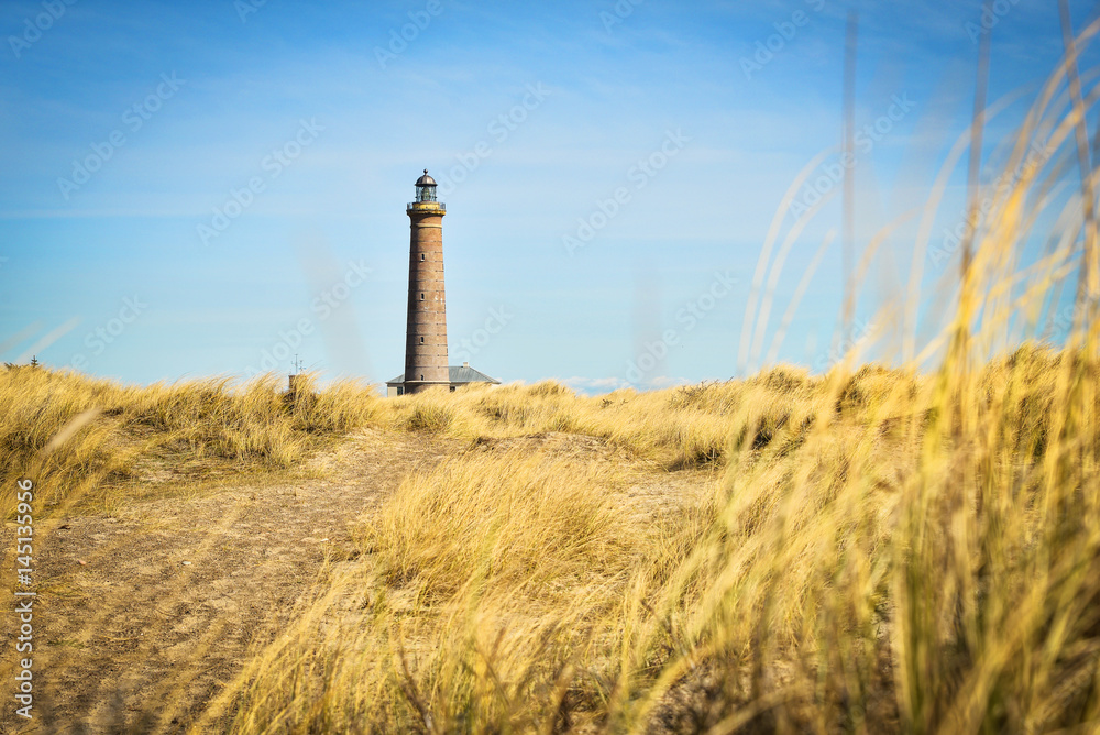 Lighthouse in Skagen, Denmark, on a sunny day Lighthouse in Skagen, Denmark, on a sunny day