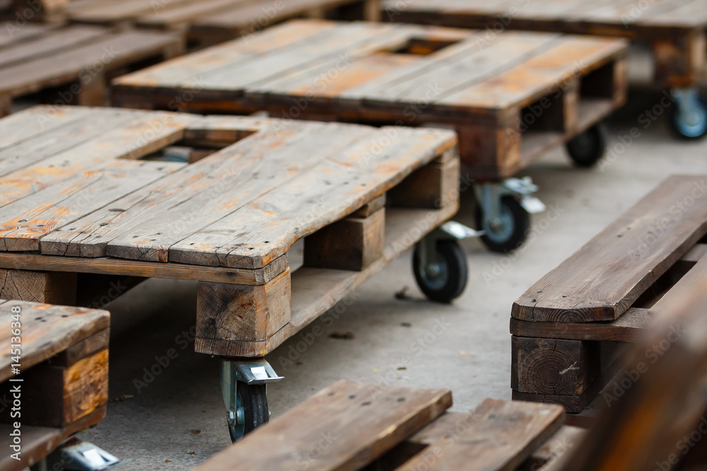 Wedding. Banquet. Decor. chill out area made of wooden storage pallets and soft pillows Decor of wooden pallets Wedding. Banquet. Decor. chill out area made of wooden storage pallets and soft pillows Decor of wooden pallets