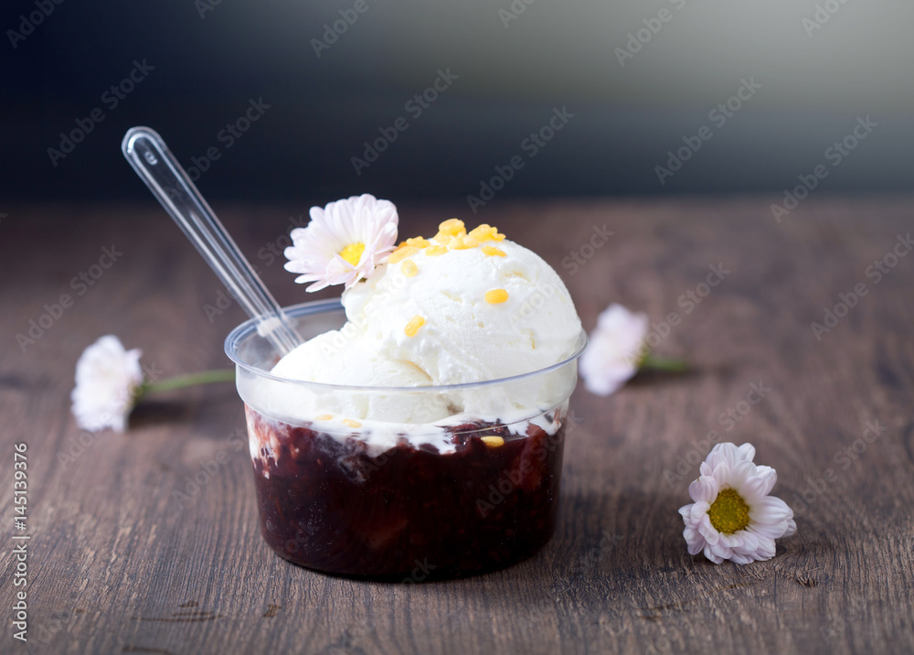 Coconut ice cream with sticky ricein and flower in bowl, Dessert and sweets, selective focus