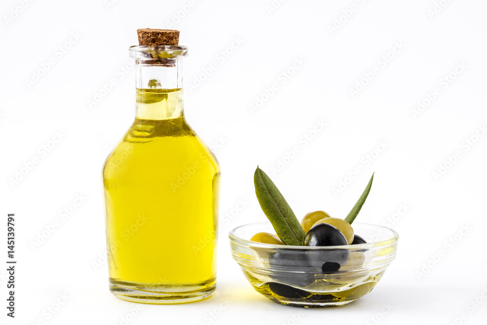 Virgin olive oil in a crystal bottle isolated on white background
Virgin olive oil in a crystal bottle isolated on white background