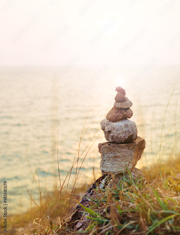 Zen stones, Sea and sunset background Zen stones, Sea and sunset background