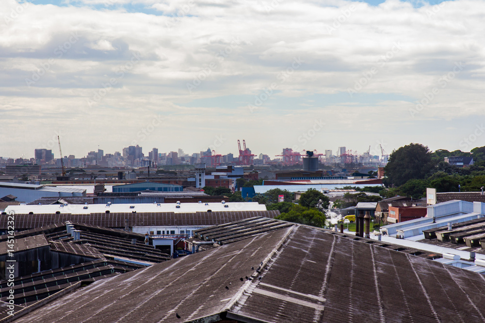 Industrial area with port city (Durban) skyline behind it #1