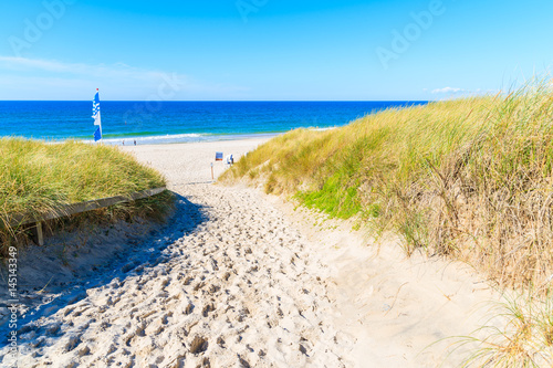 Entrance to sandy beach in Kampen village on Sylt island, Germany