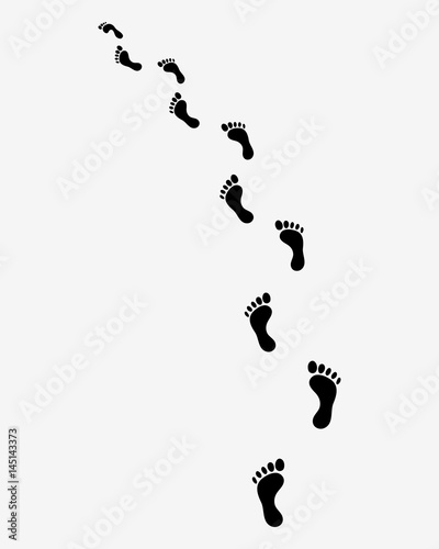 Trail of human bare footsteps, turn left