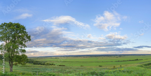 Panoramic view on Zhizdra river valley at evening twilight. Verkhnee Alopovo village, Kaluzhskaya region, Russia. 