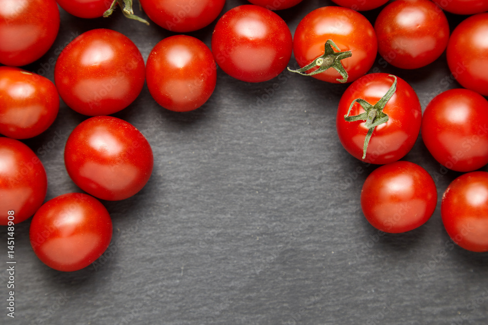 Cherry tomatoes over stone table. Cherry tomatoes over stone table.