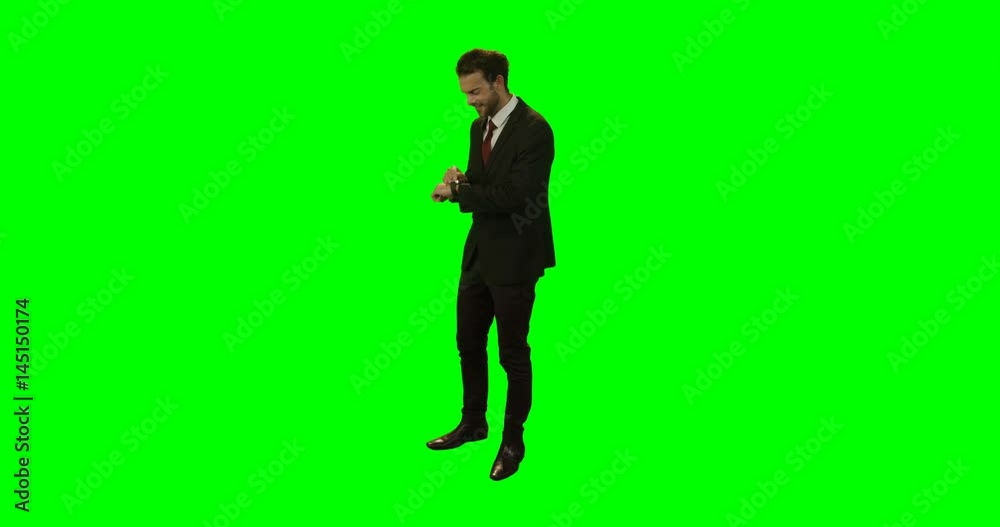 Smiling businessman using smartwatch Smiling businessman using smartwatch