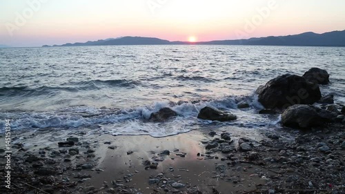 Beuatiful waves of mediterranean sea during sunset near hisaronu, marmaris