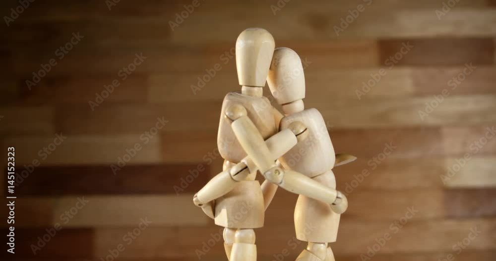 Romantic couple figurines embracing each other Romantic couple figurines embracing each other