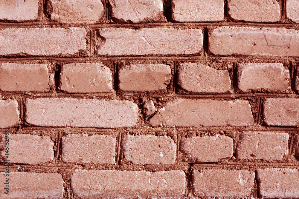 Obraz premium Red toned weathered brick wall texture.