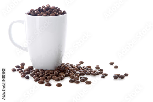 White cup and coffee beans