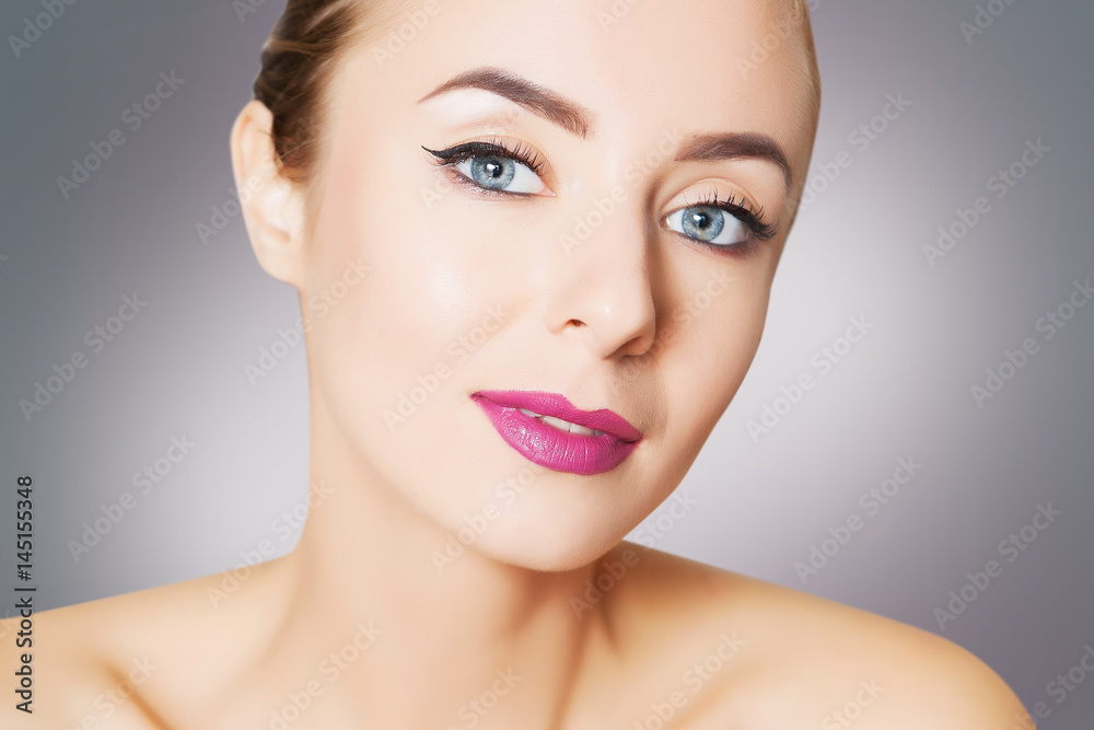 portrait of model with perfect skin over grey background portrait of model with perfect skin over grey background