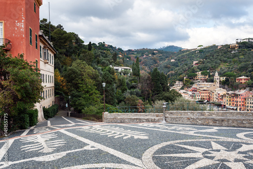 Beautiful square mad of small stones at hill of Portofino town, Italy  photo