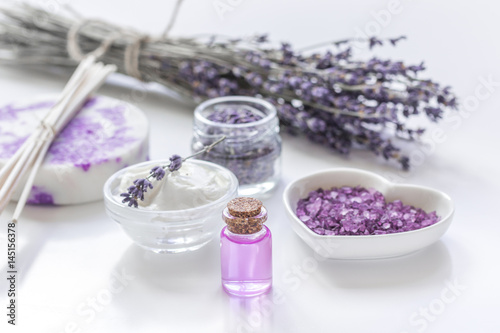 lavender flowers in organic cosmetic set on white background