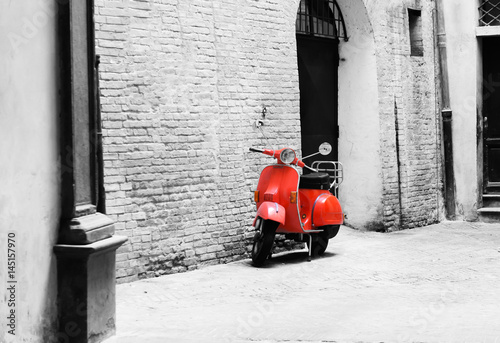 vespa roja sobre fondo blanconegro photo