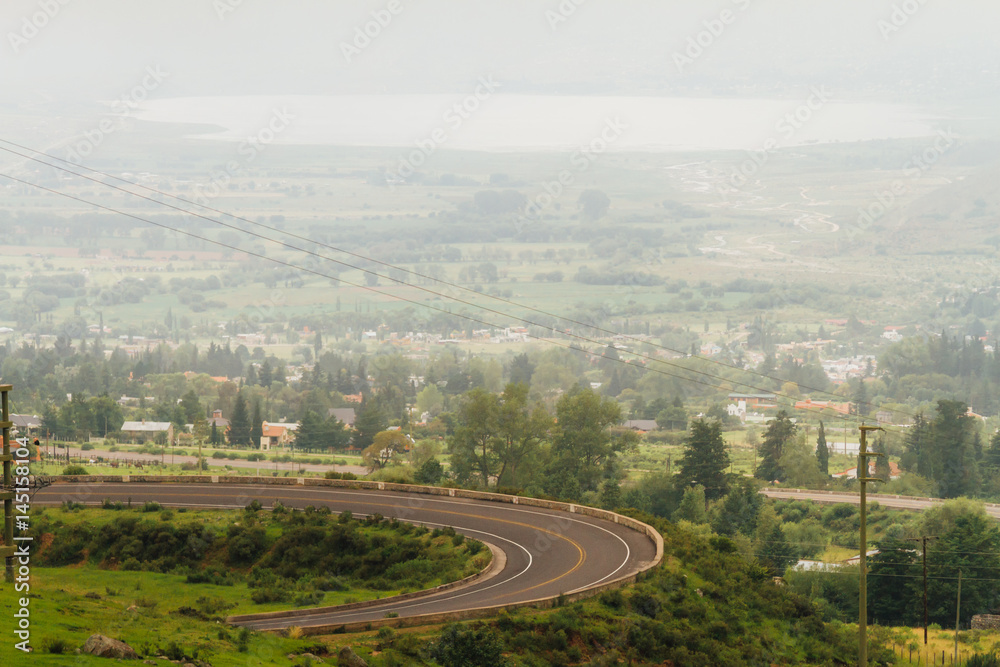 Curve of a road with view of the city of Tafi del Valle, Tucumán, Argentina