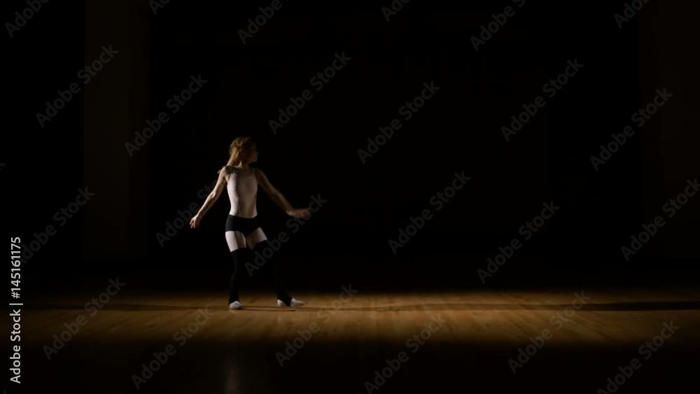 Energetic dancer performing acrobatic dance sequence