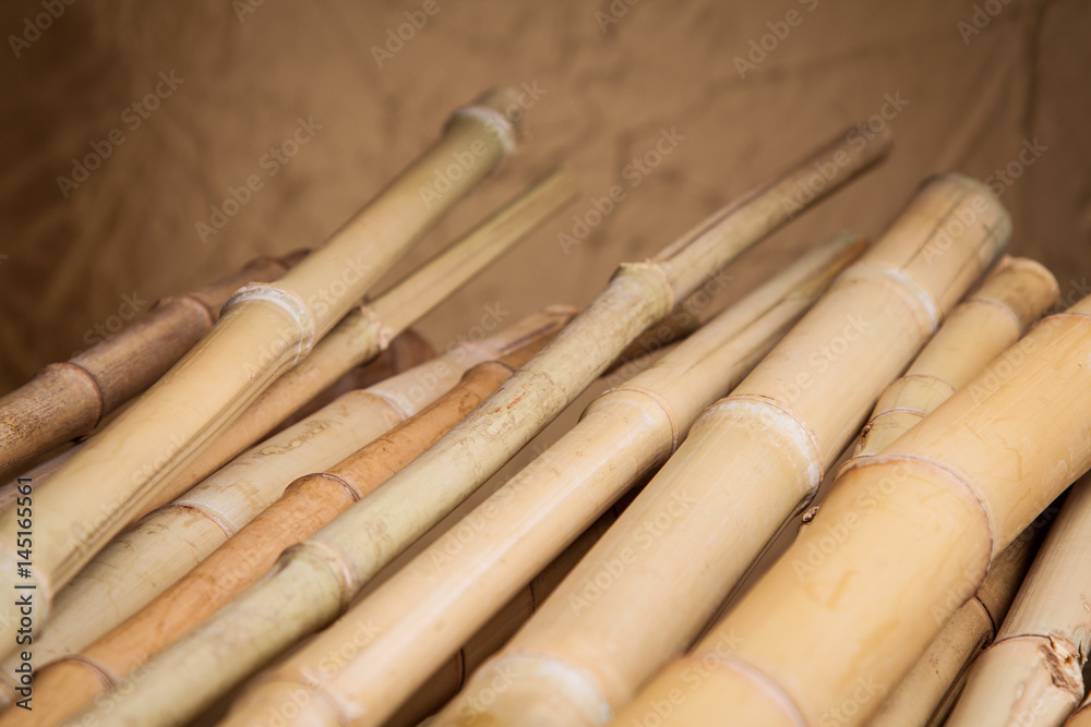 detail of bamboo stalks on a wooden table detail of bamboo stalks on a wooden table