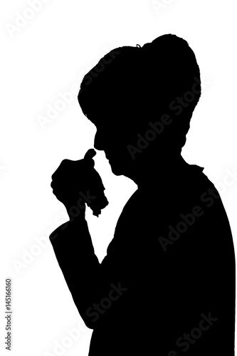 Front profile portrait silhouette of elderly lady finger on lips thinking