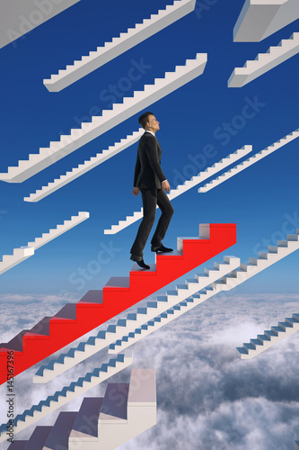 Upwards. Businessman climbs a red flying stairs.