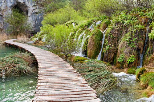 Winding wooden pathway and waterfalls in Plitvice National Park  Croatia