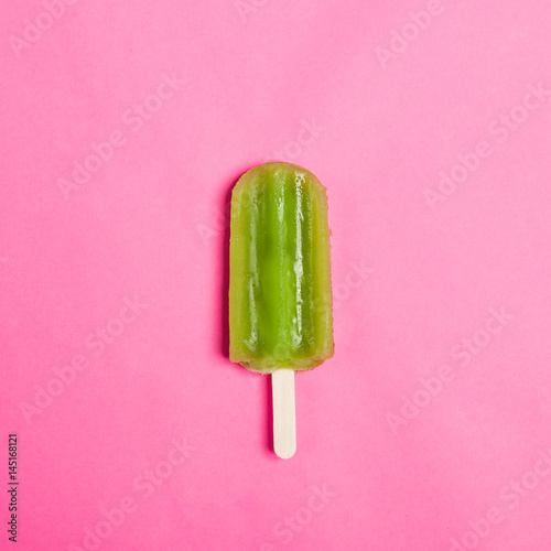Tasty and refreshing popsicles on pink background