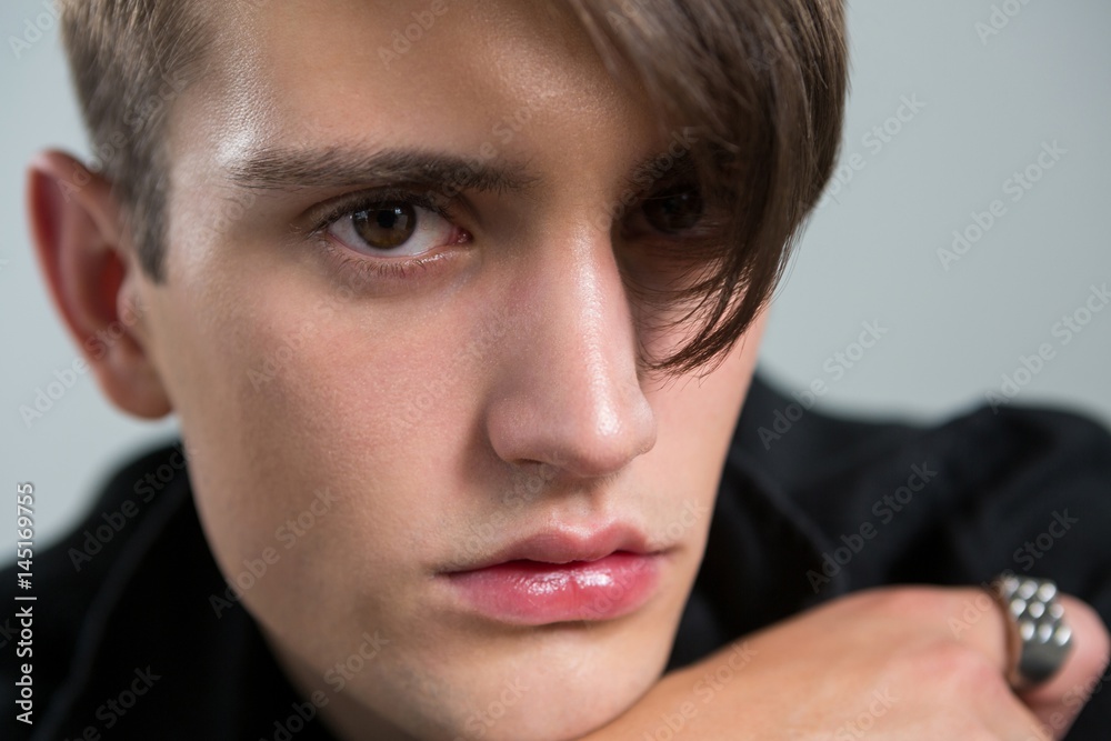 Androgynous man looking at camera Androgynous man looking at camera