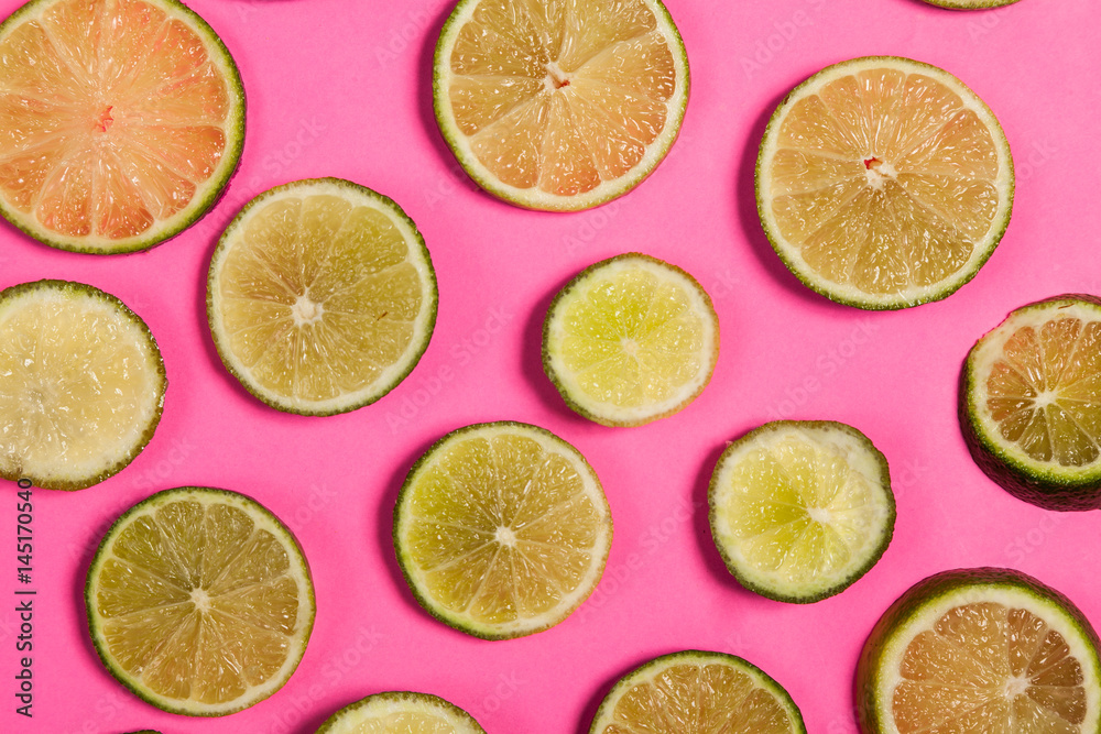 Sliced lemon on pink background Sliced lemon on pink background