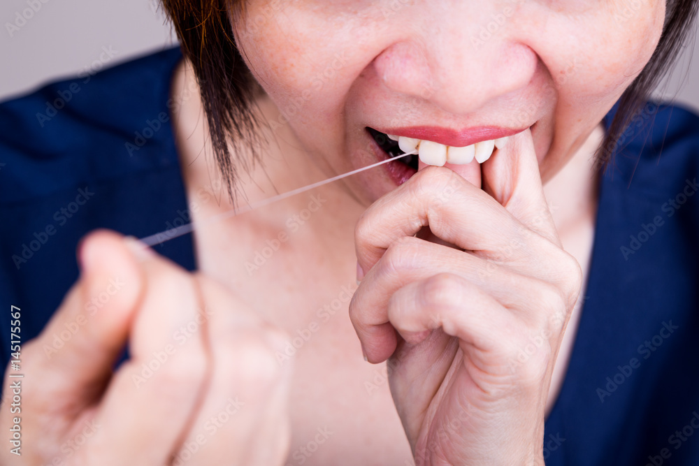 Series of Asian woman flossing teeth with oral floss Series of Asian woman flossing teeth with oral floss