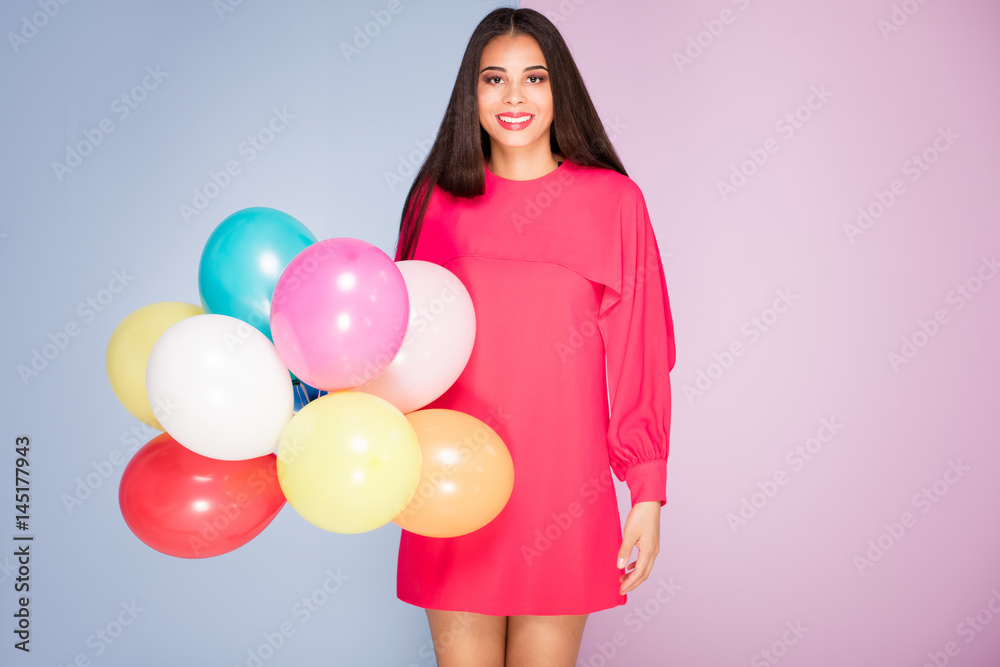 Smiling african american girl with balloons. Smiling african american girl with balloons.