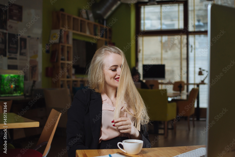 Young businesswoman drink coffee and relaxing in office Young businesswoman drink coffee and relaxing in office