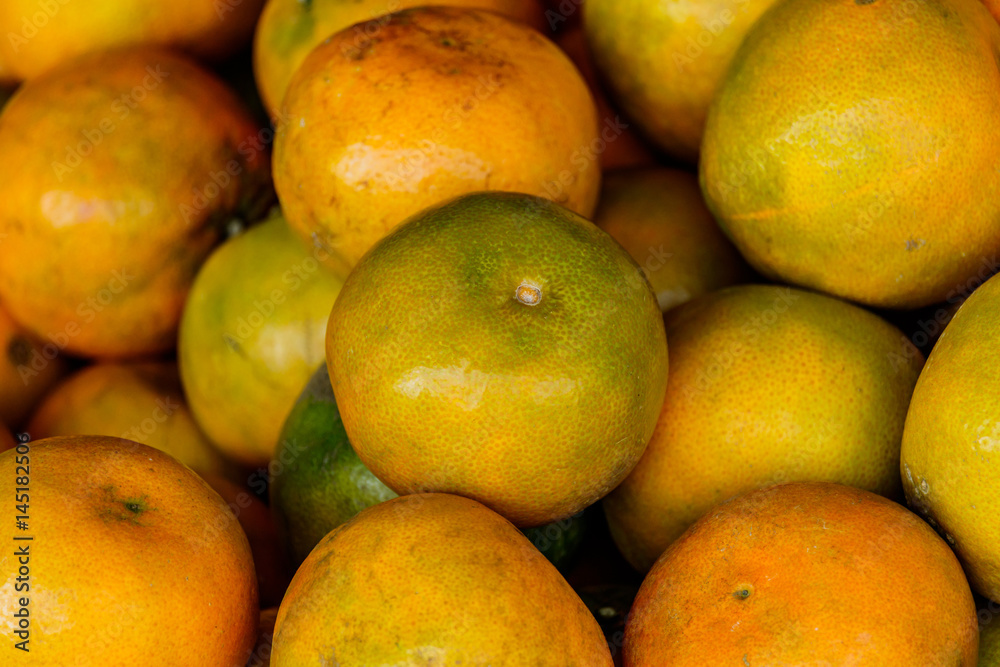 Oranges are sold in local markets in Thailand.