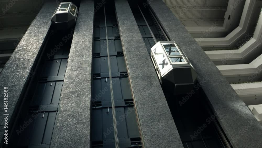 Modern hotel office skyscraper building elevator lift moving up