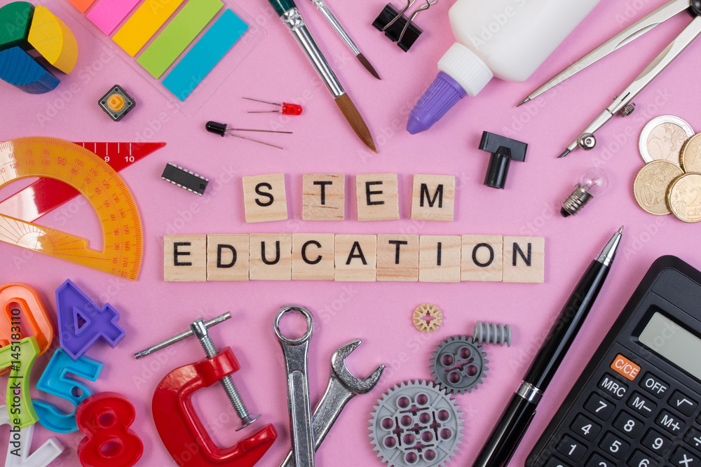 School equipment with word STEM Education over pink background in ...