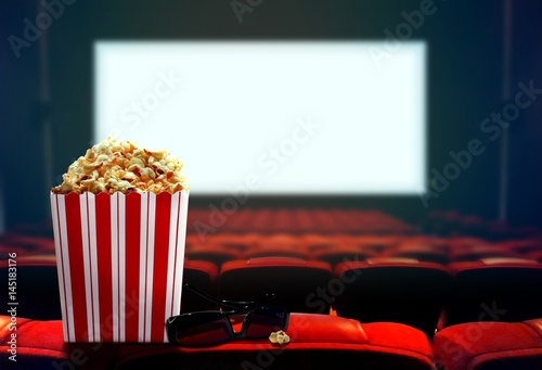 Cinema seat with popcorn and 3d glasses