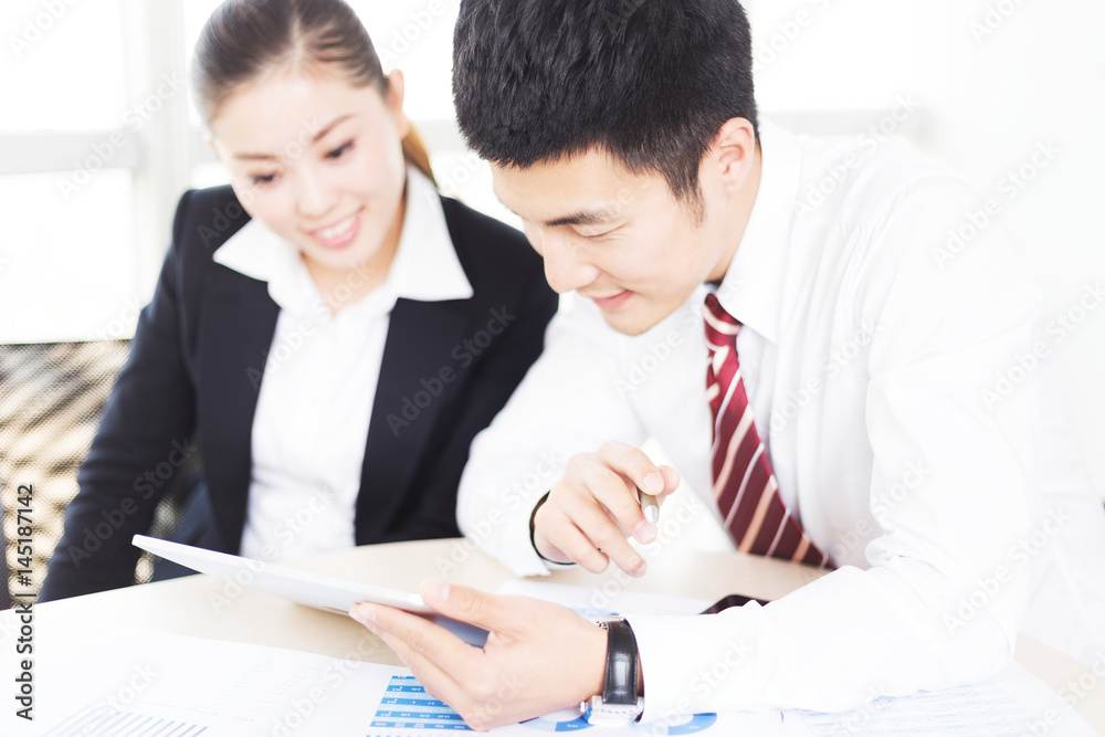 young asian businessman and businesswoman in modern office young asian businessman and businesswoman in modern office