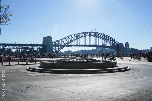 people at walkway to Opera House with Harbour Bridge background taken in Sydney Australia on 6 July 2016
