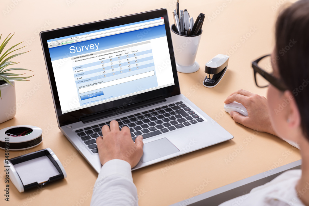 Businesswoman Filling Survey Form Businesswoman Filling Survey Form